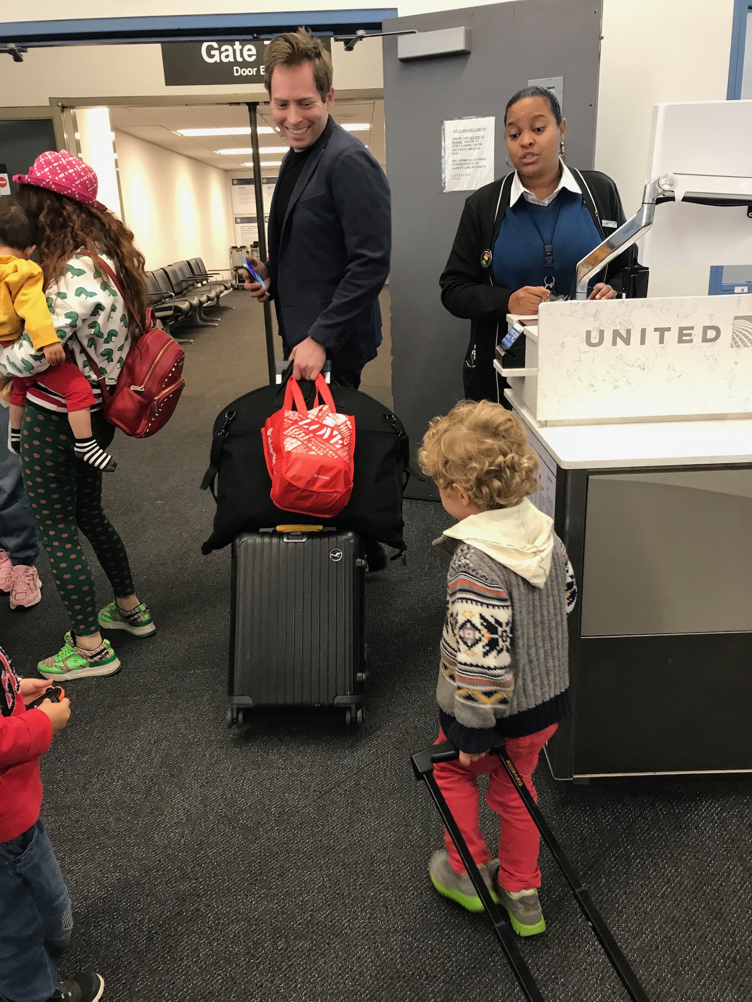 a group of people standing in an airport