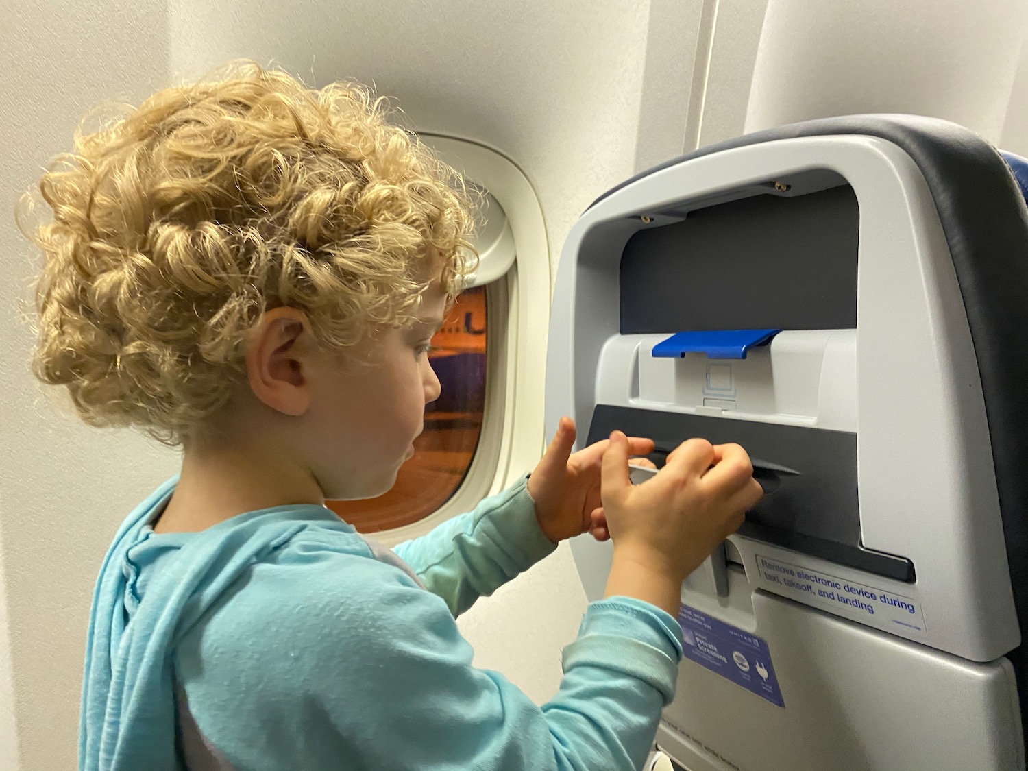 a child using a paper dispenser