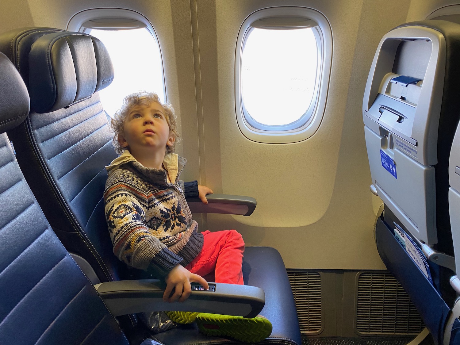 a child sitting in a plane