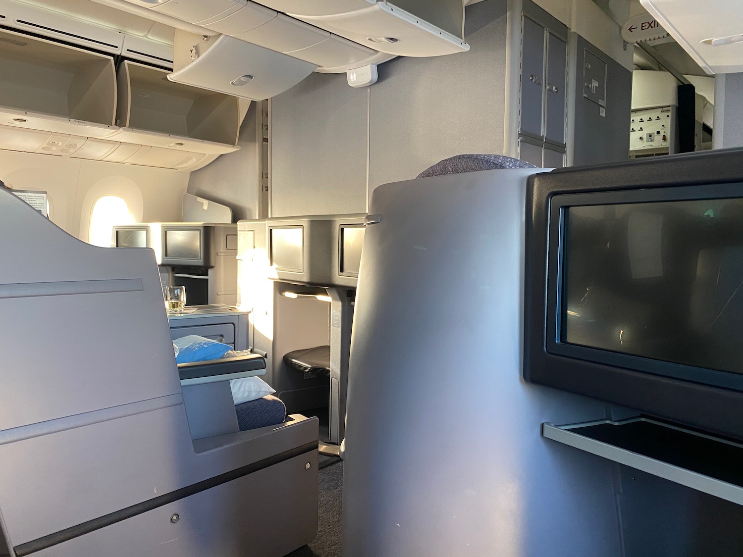 a tv and cabinets in an airplane