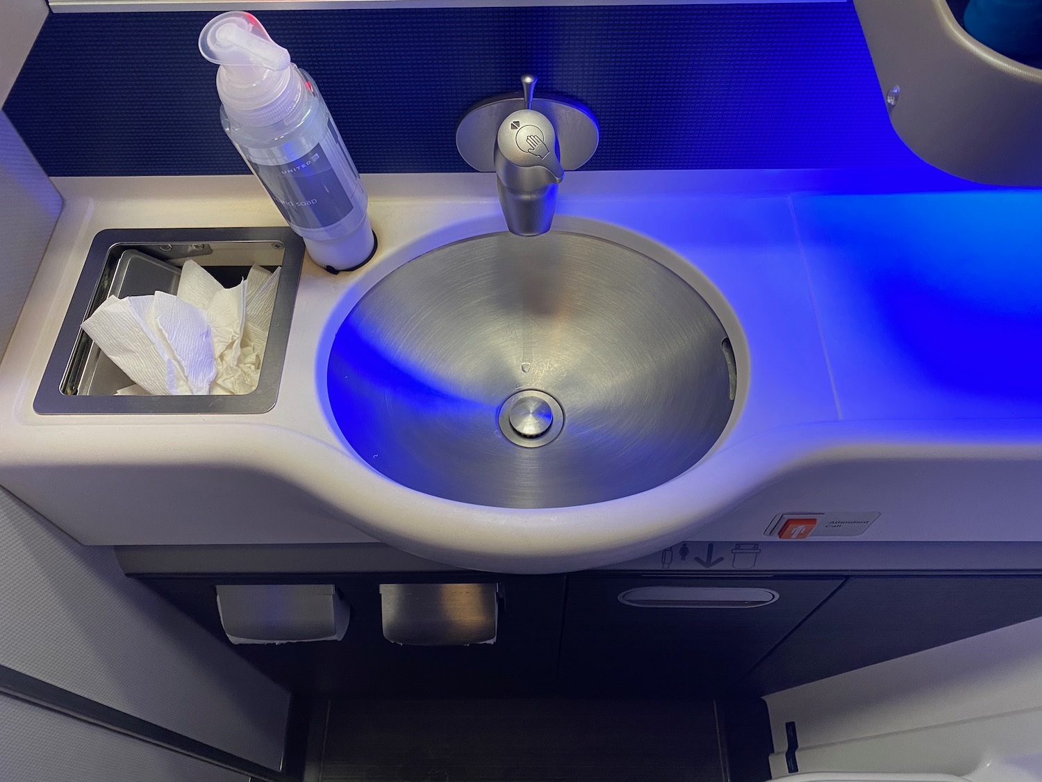 a sink with a blue light