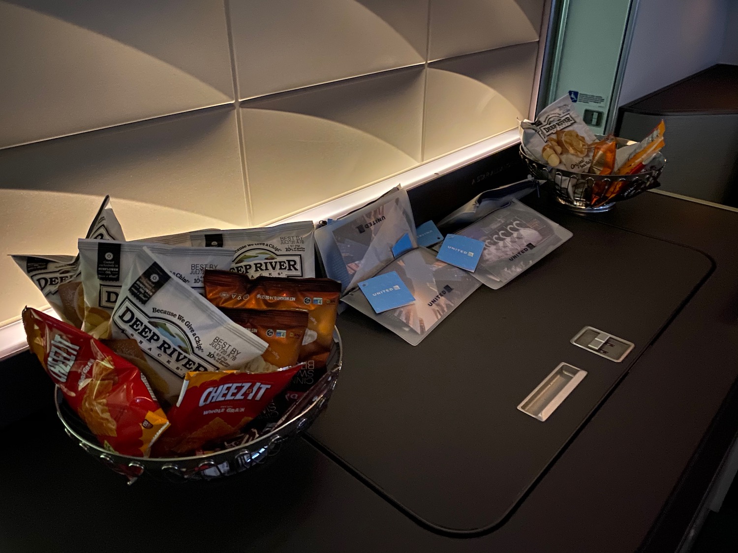 a bowl of chips and snacks on a counter