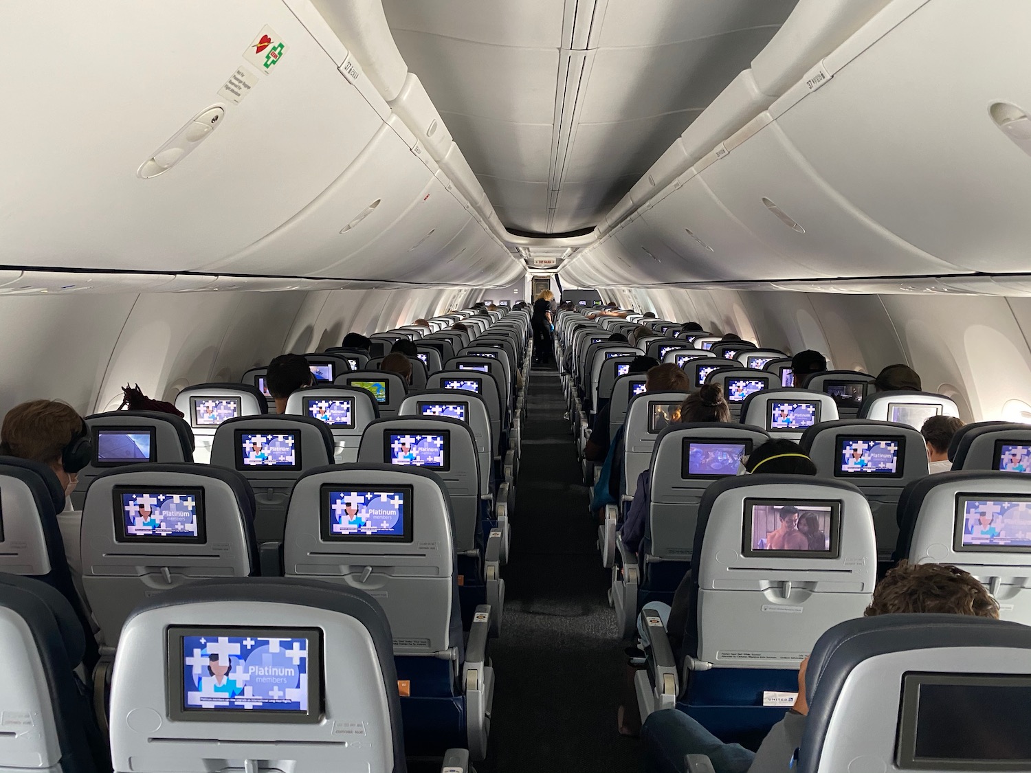 a group of people sitting in an airplane