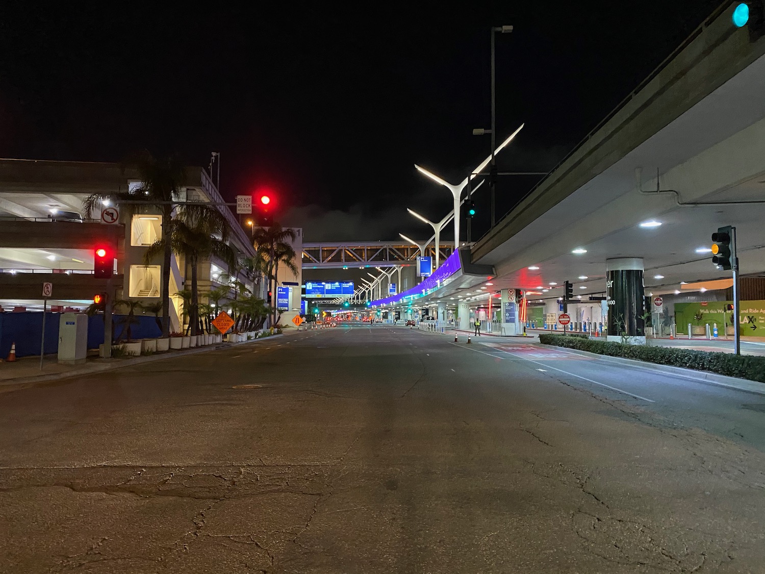 a street with lights and buildings at night