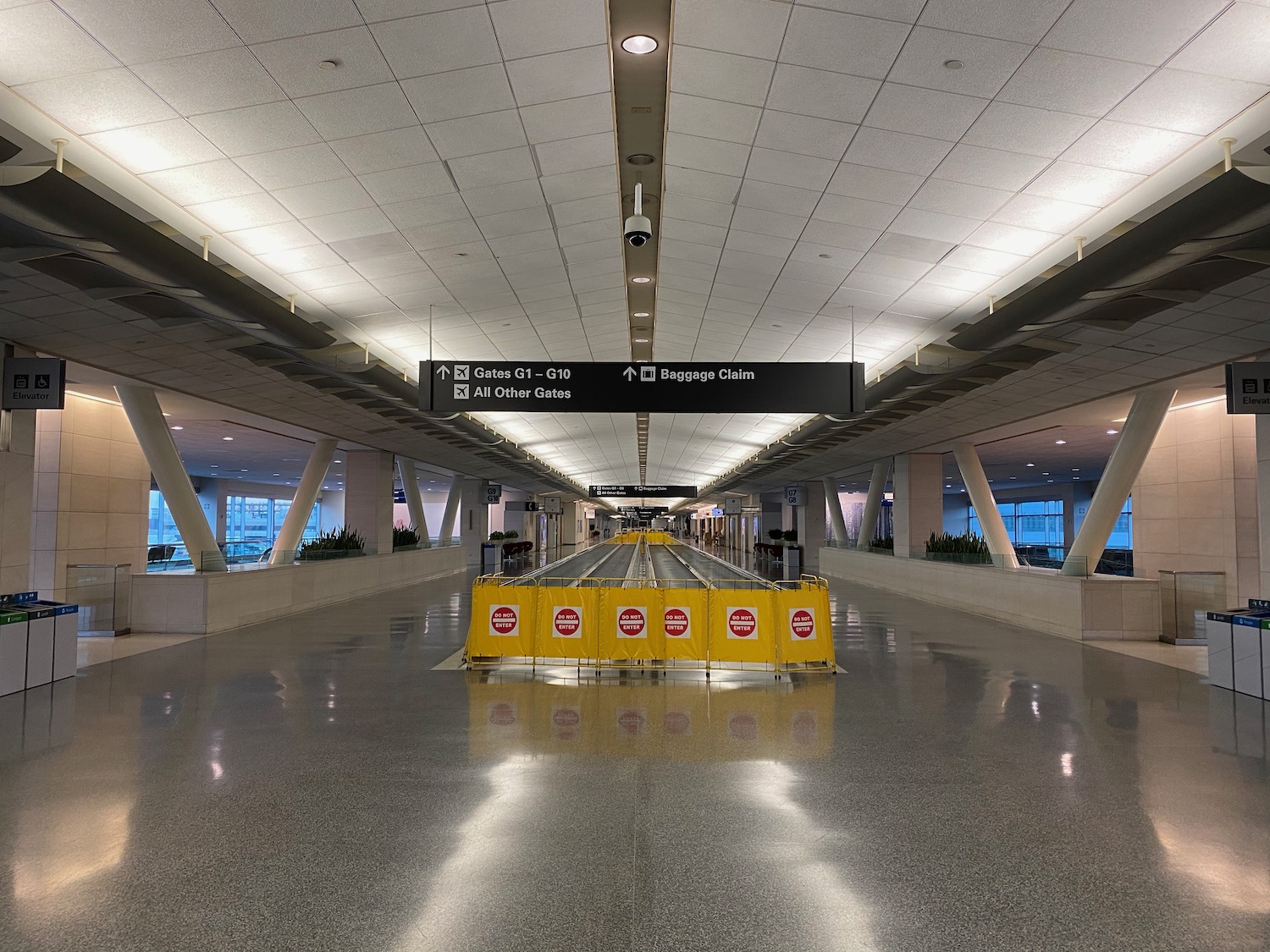 a yellow sign in a airport