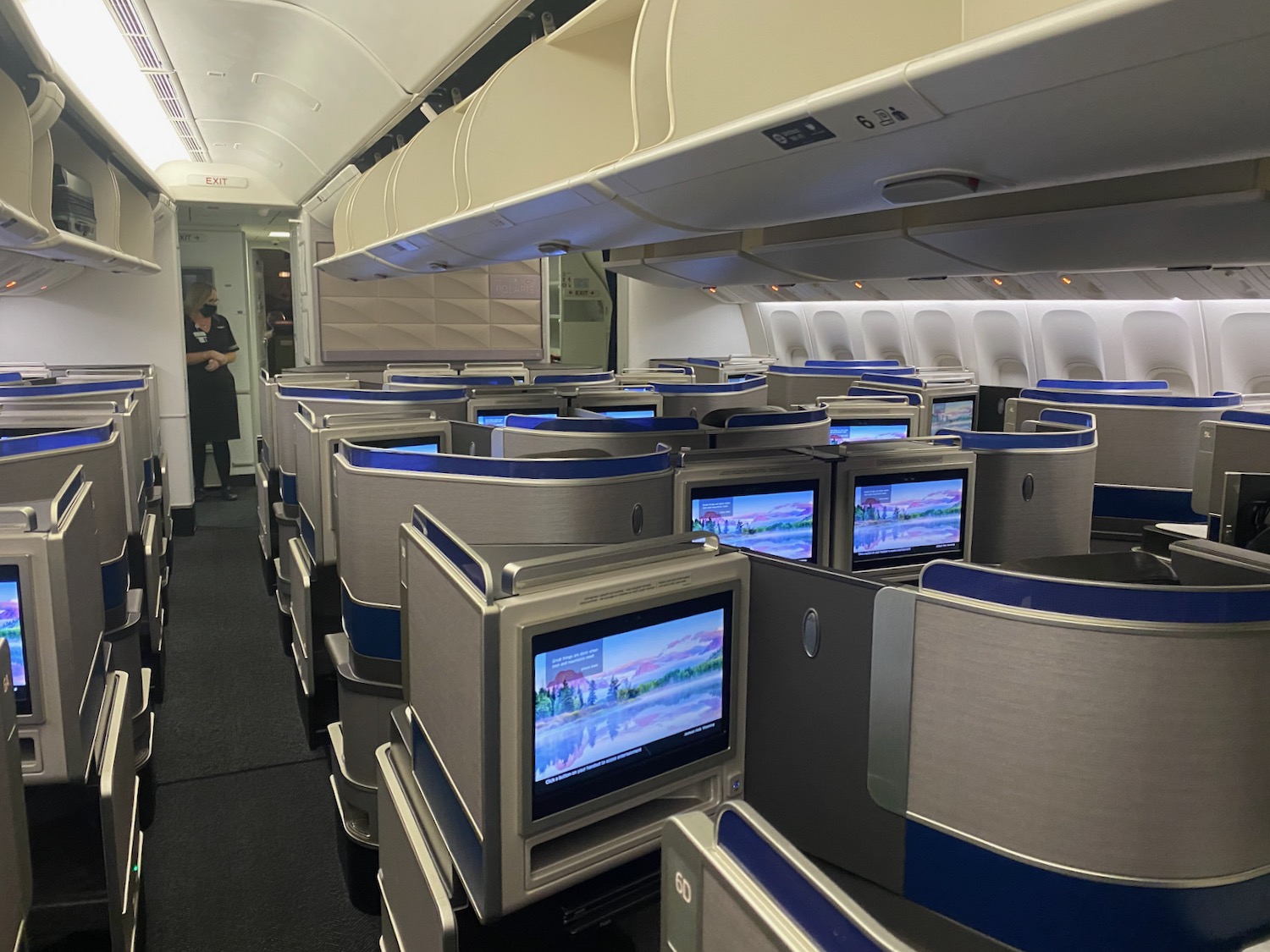 a row of tvs on an airplane