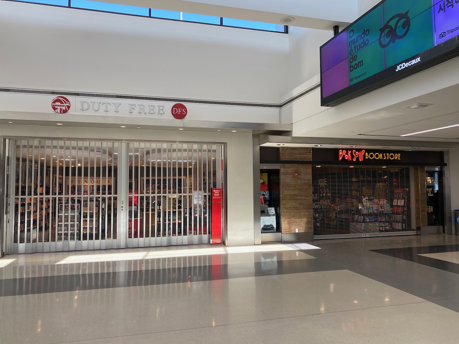 a storefront with a screen above it