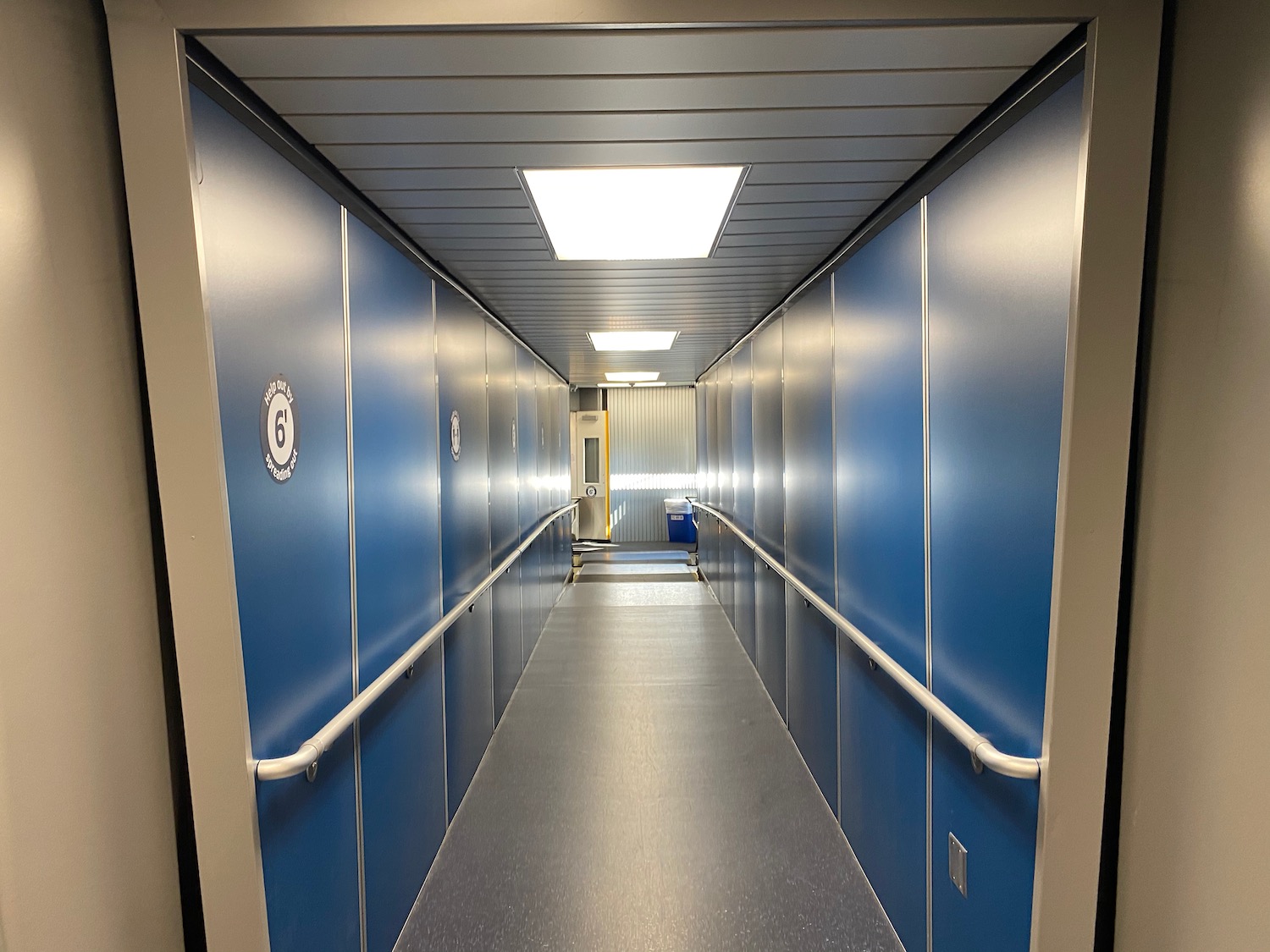 a hallway with blue doors