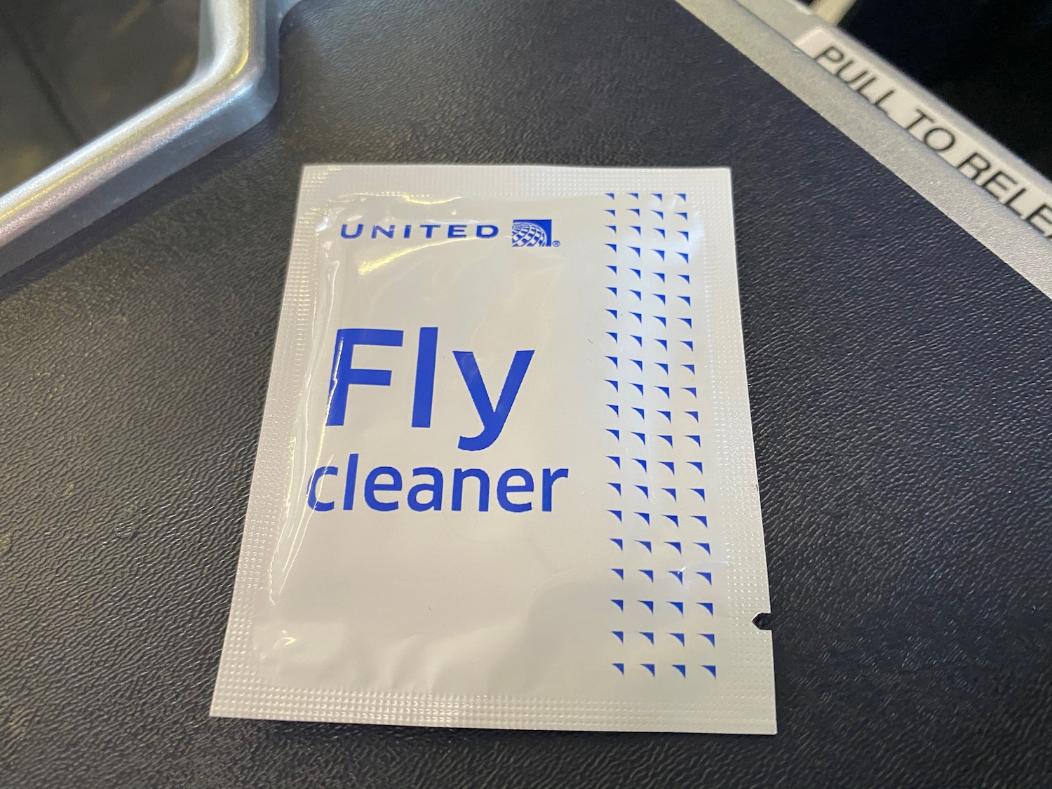 a white packet with blue text on it