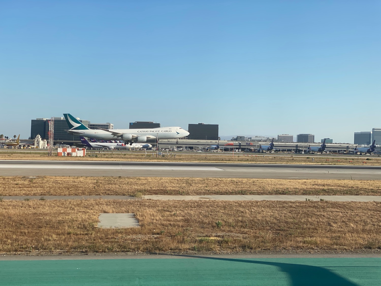 a group of airplanes on a runway