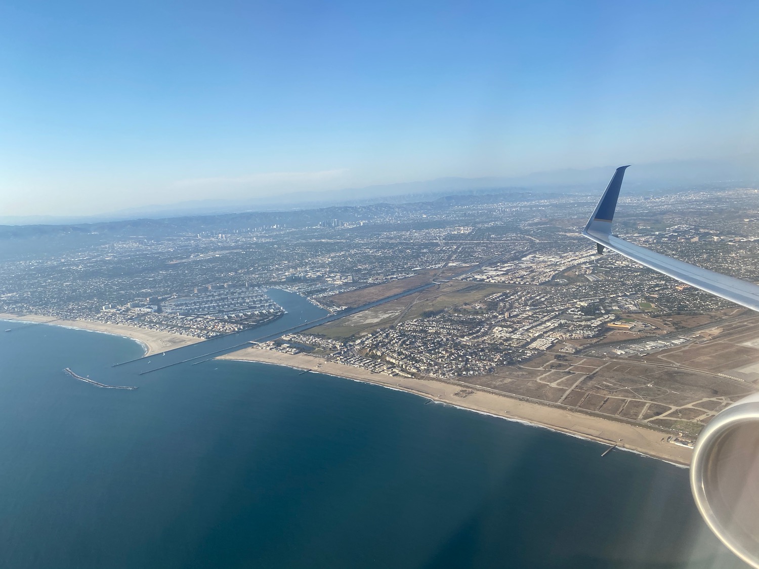 an airplane wing over a body of water