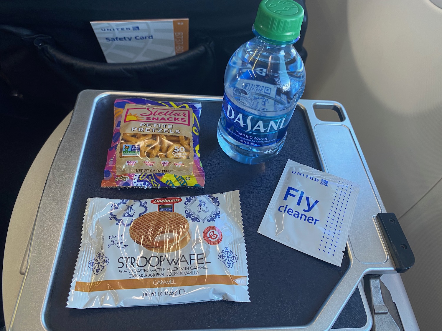 a tray with food and a bottle of water on it