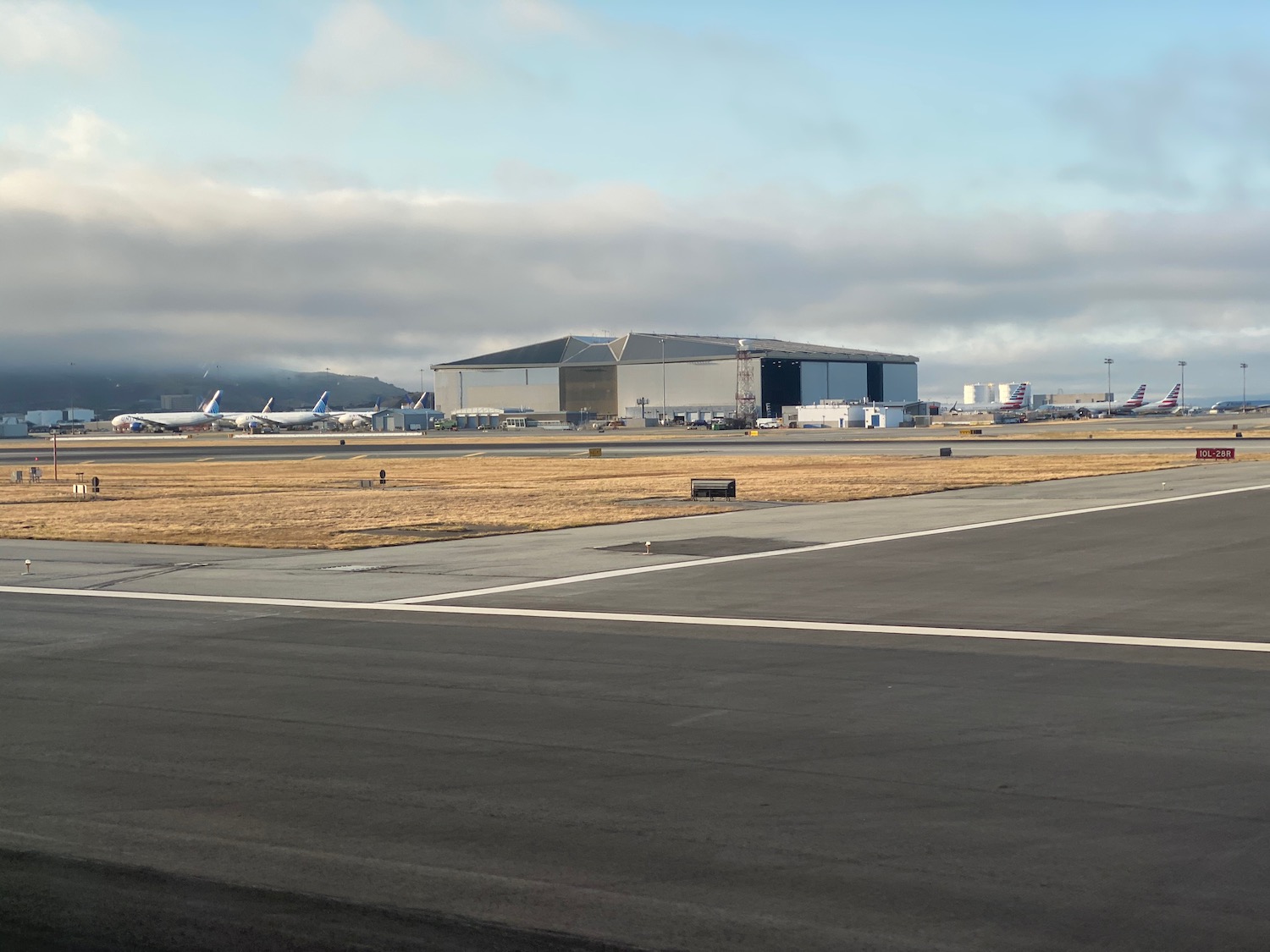 an airport with airplanes in the background