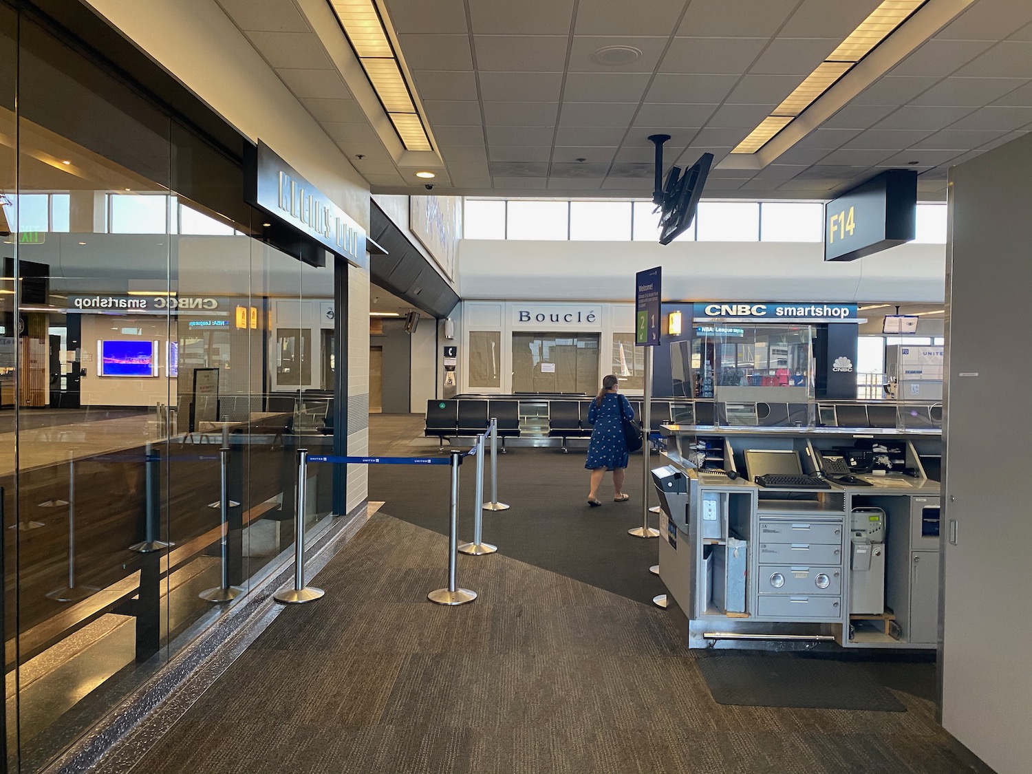 a woman standing in a terminal