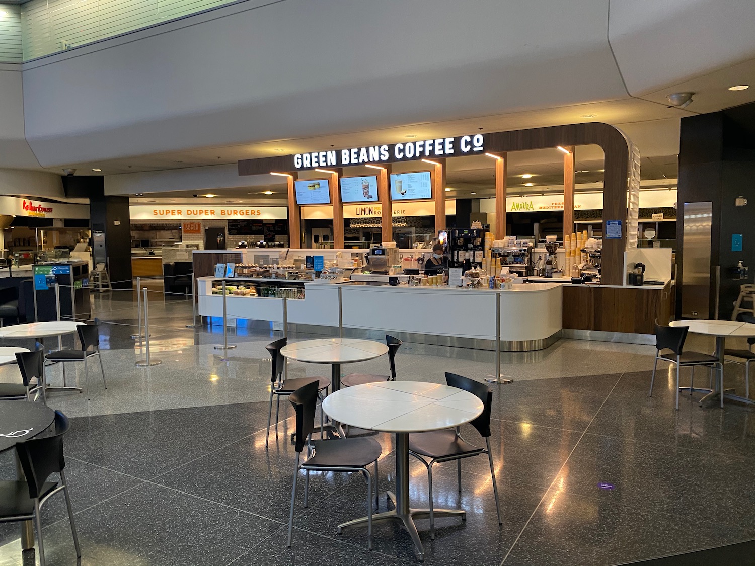 a coffee shop with tables and chairs