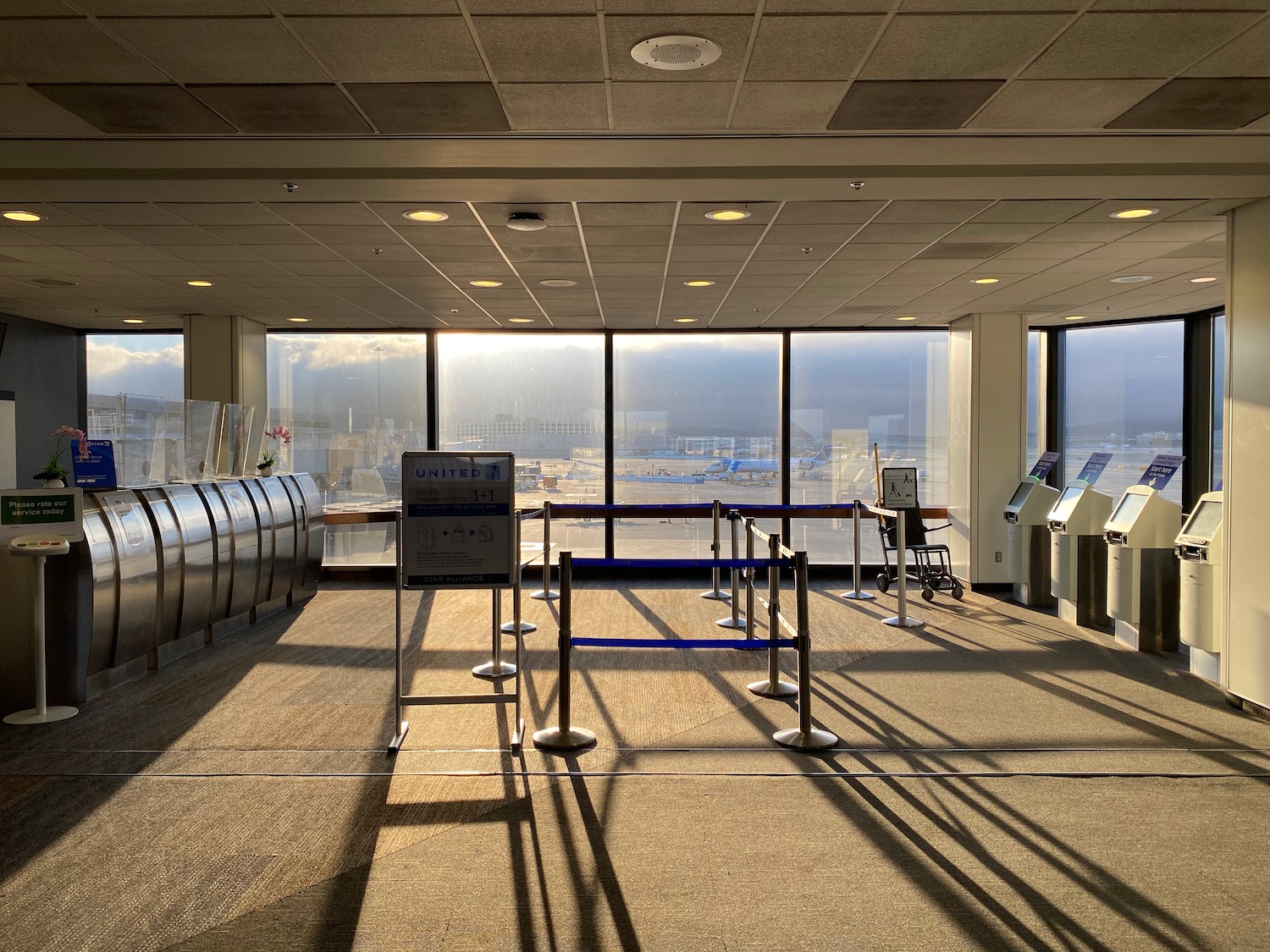 an empty airport with a gated area