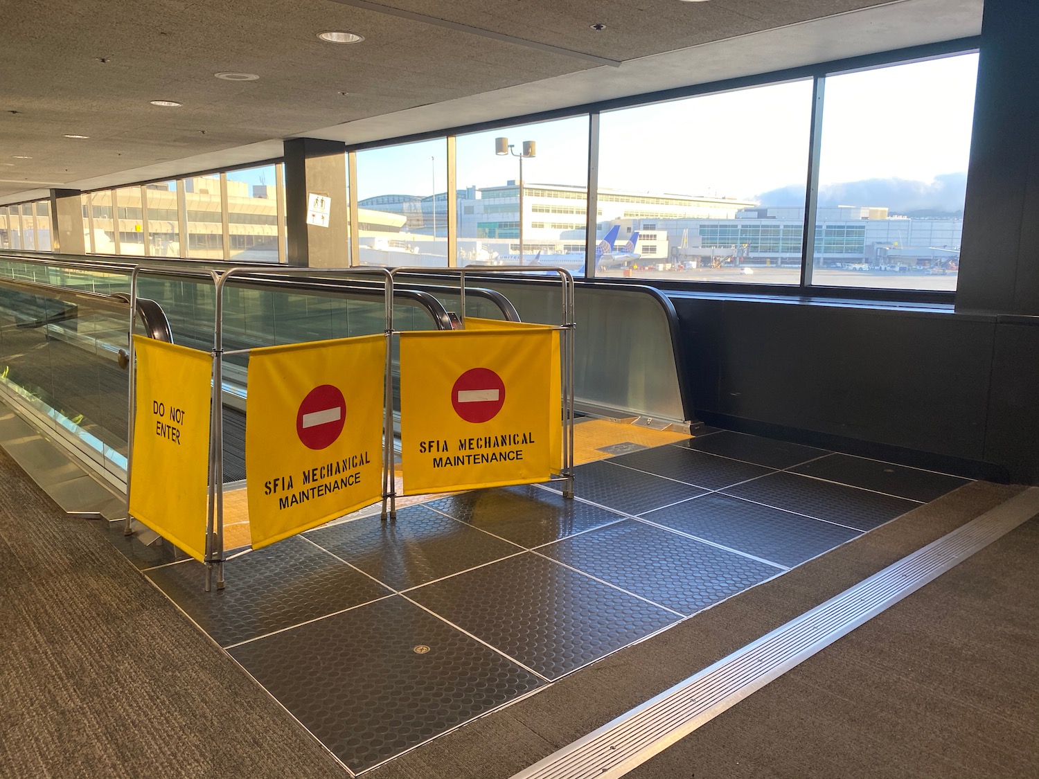 a yellow signs on a metal rack