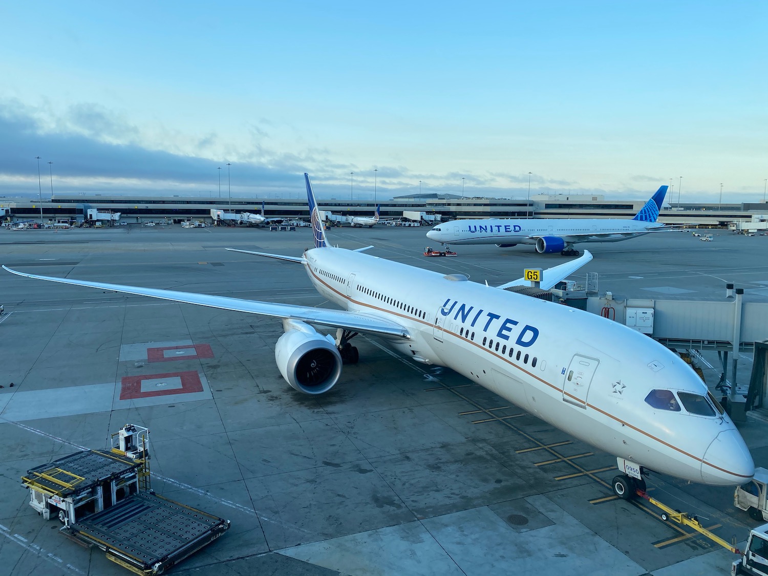 a group of airplanes at an airport