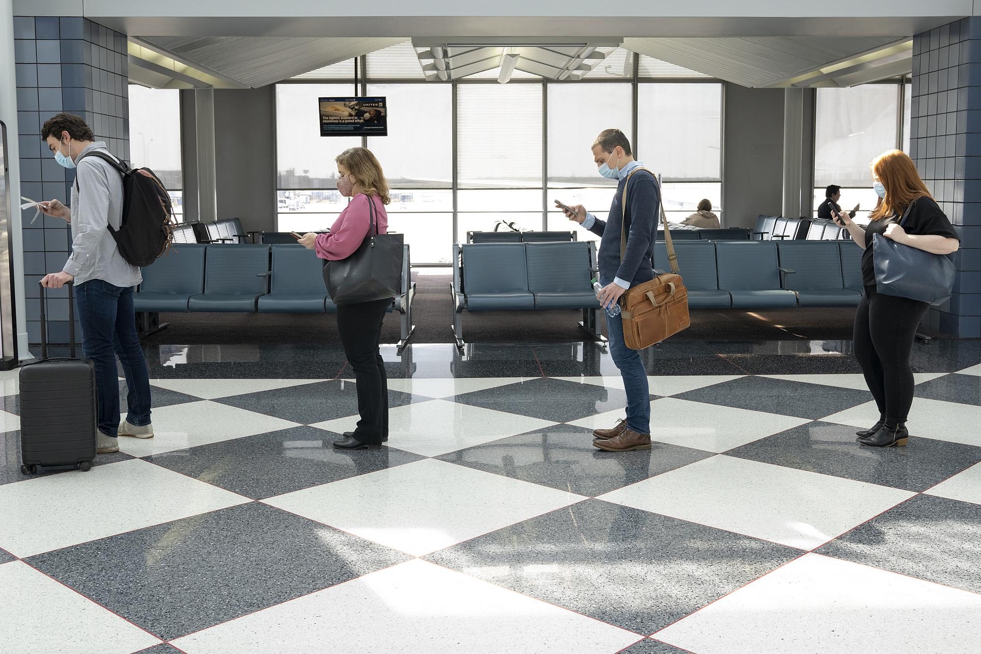 a group of people in a checkered room