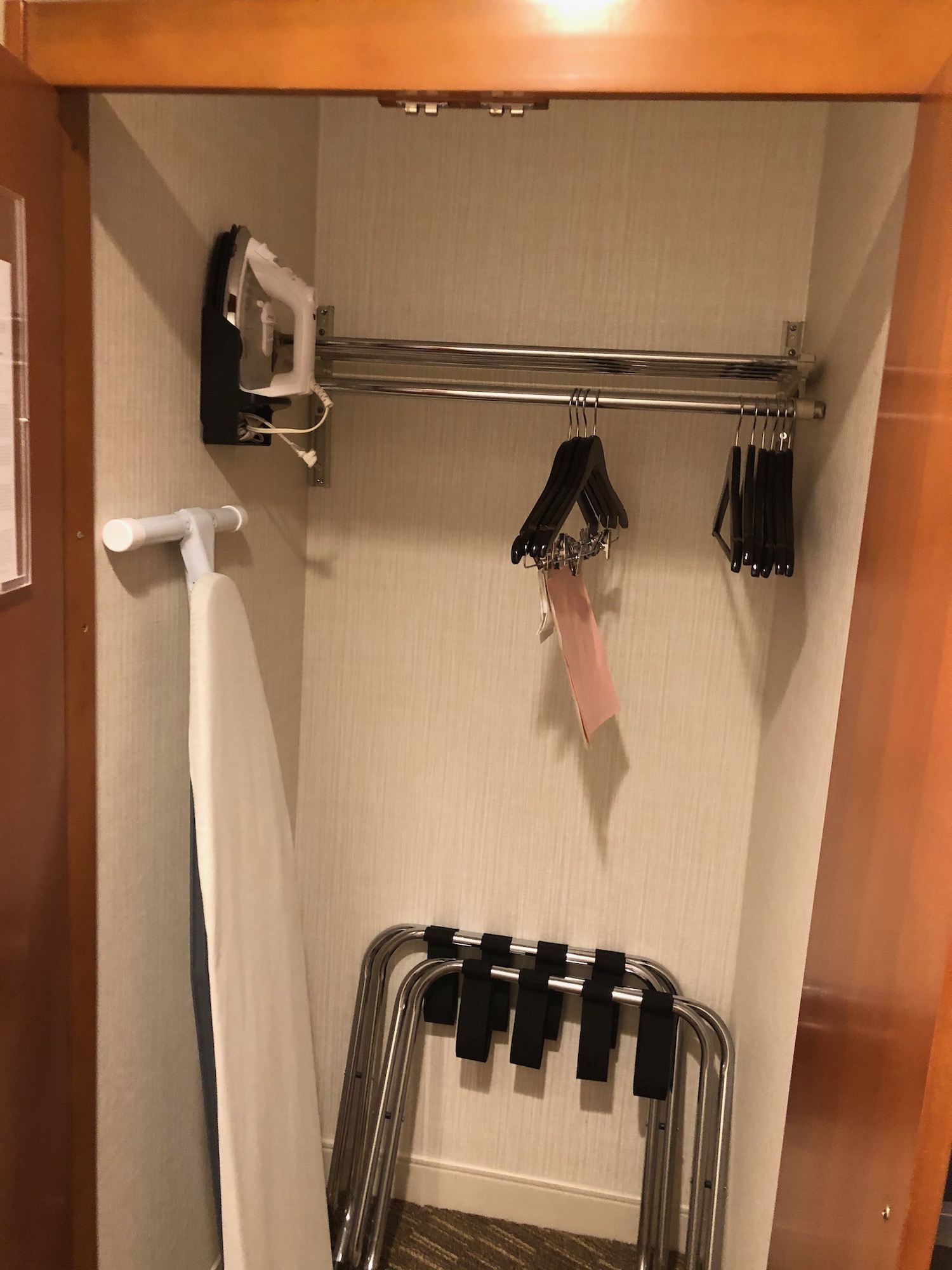 a swingers and clothes rack in a room