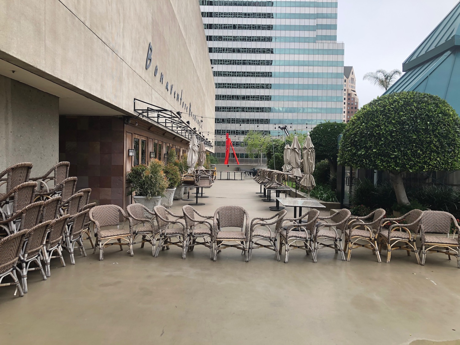 a group of chairs and tables outside a building