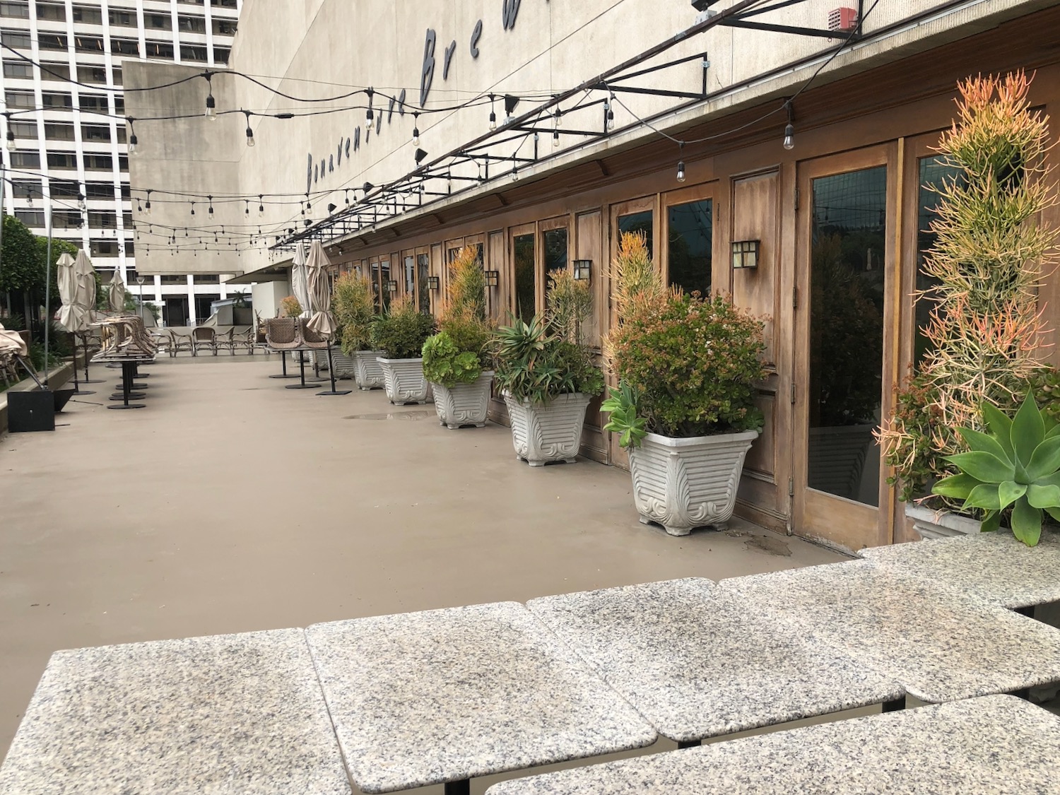 a row of chairs and tables outside of a building