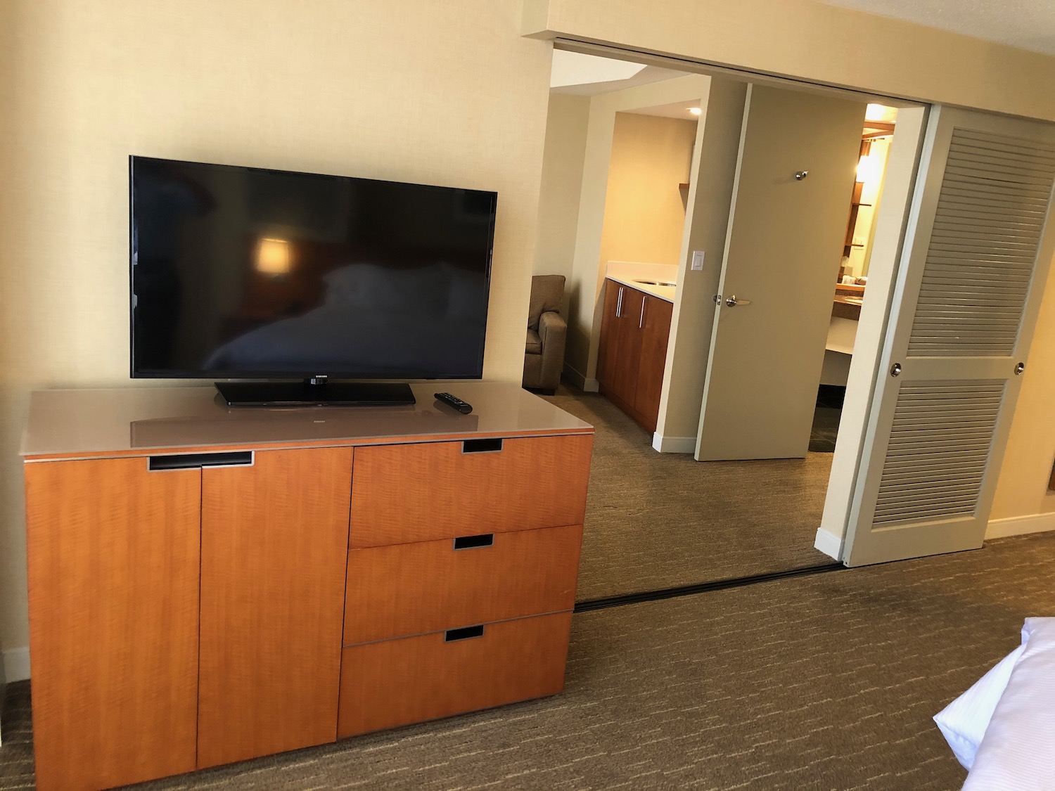 a tv on a dresser in a room