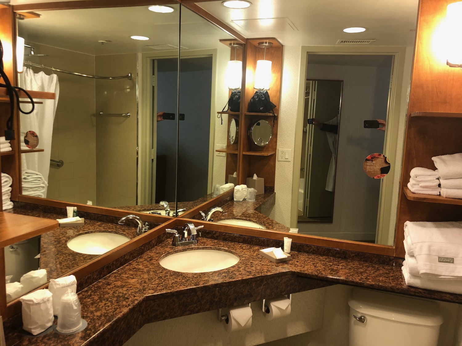 a bathroom with a large mirror and sinks