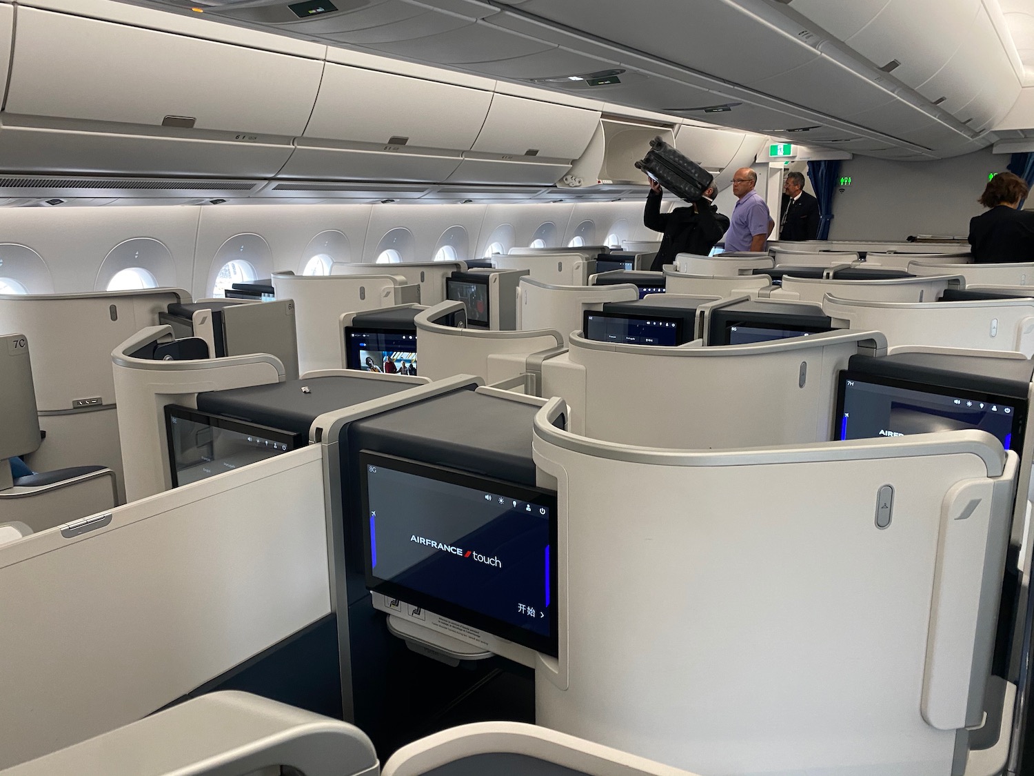 a group of people standing in an airplane