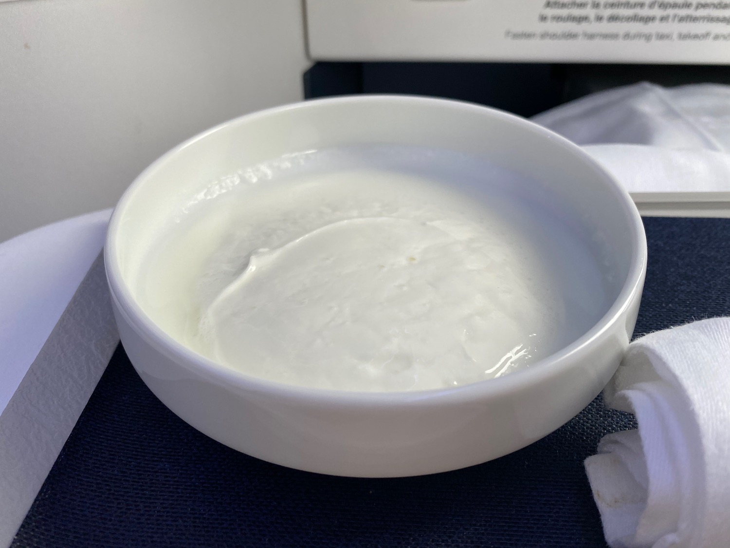 a white bowl with liquid in it