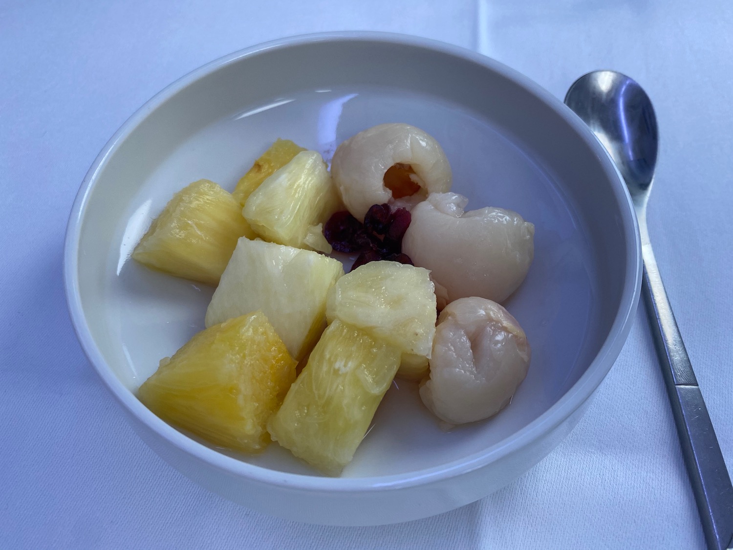 a bowl of fruit on a table