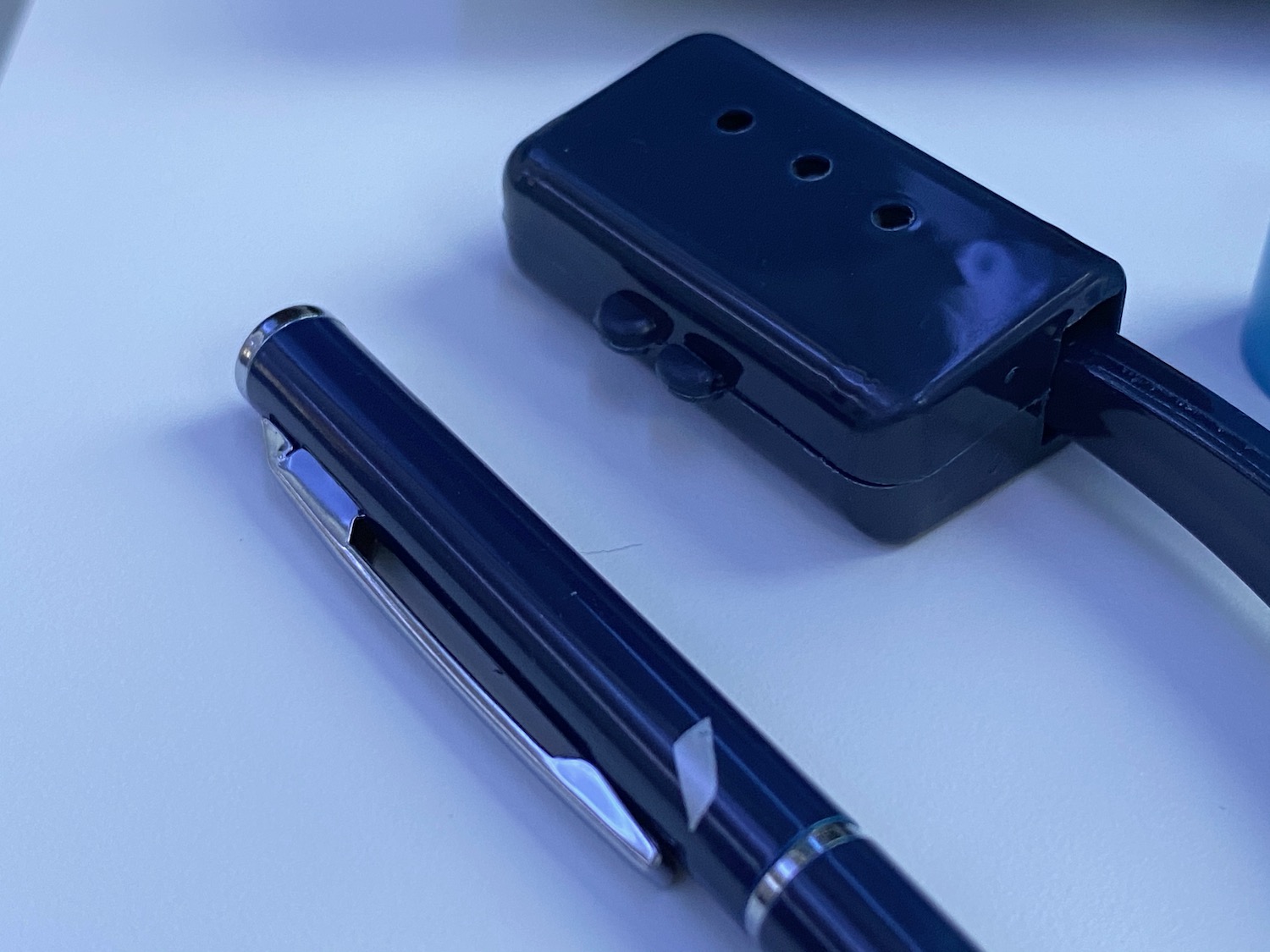 a pen and a blue pen