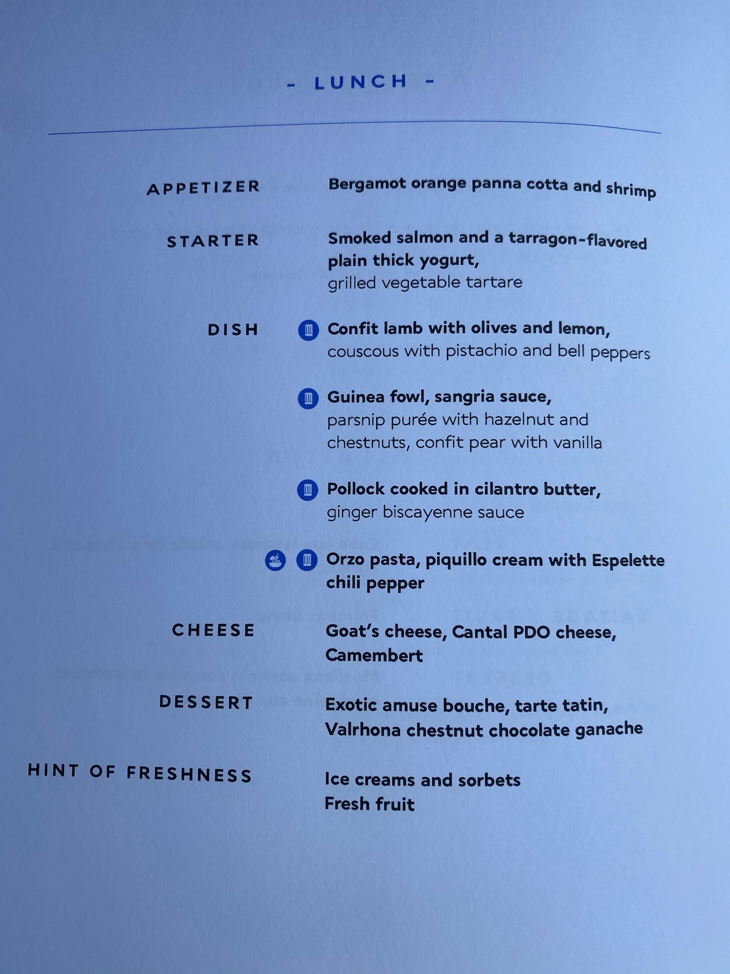 a menu of food on a white surface