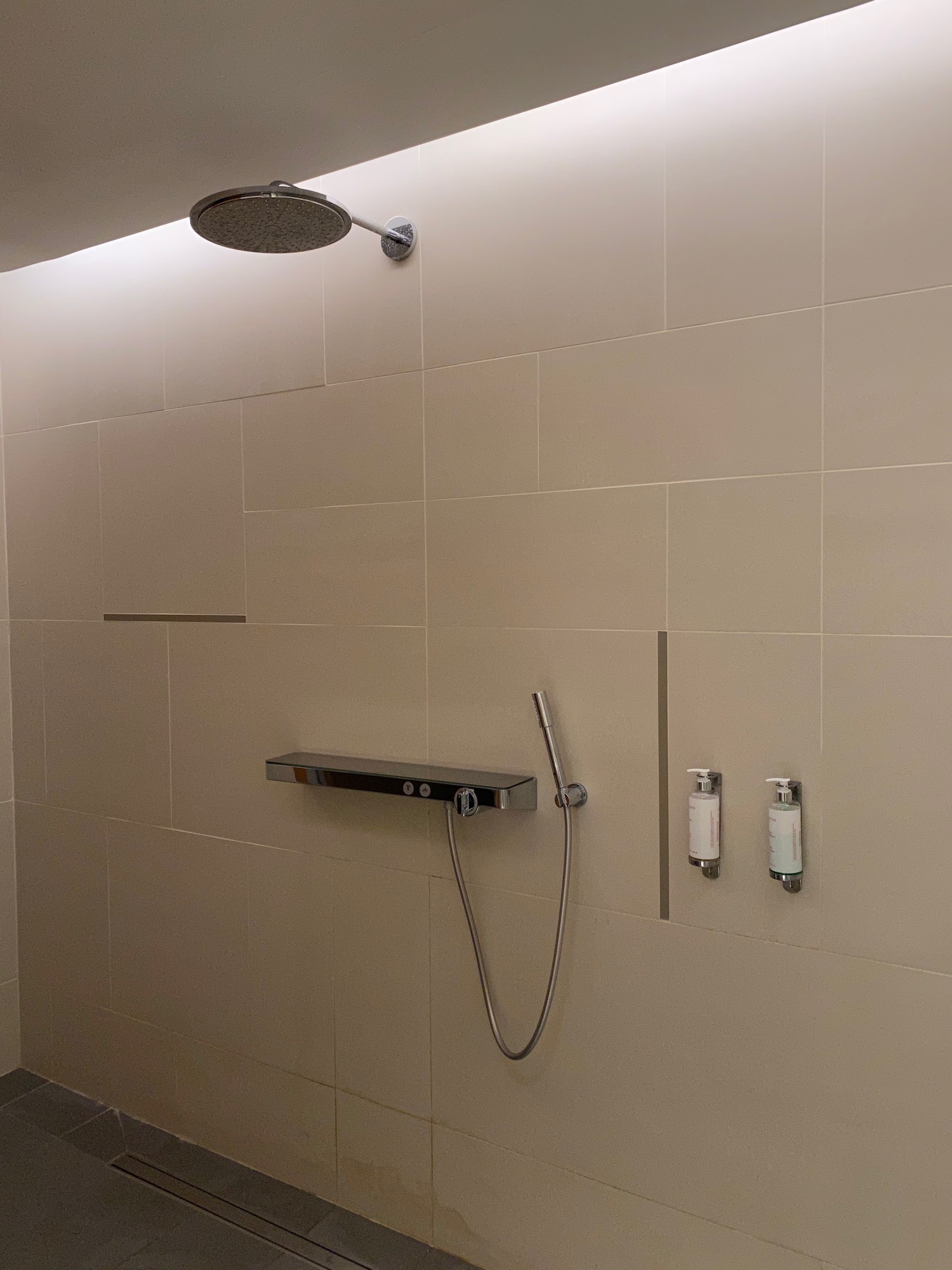 a shower head and soap dispenser