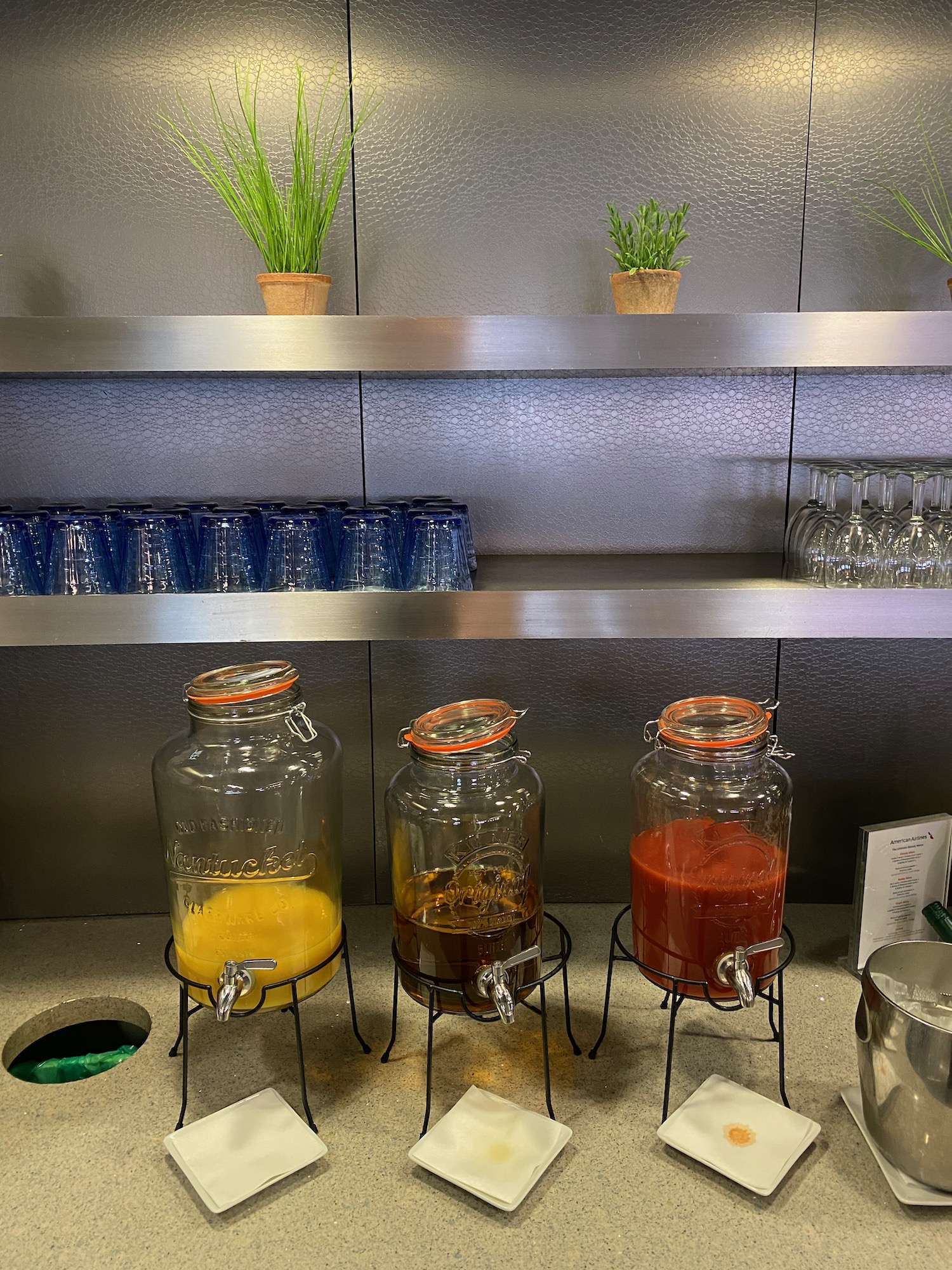 a row of glass jars with liquid in them