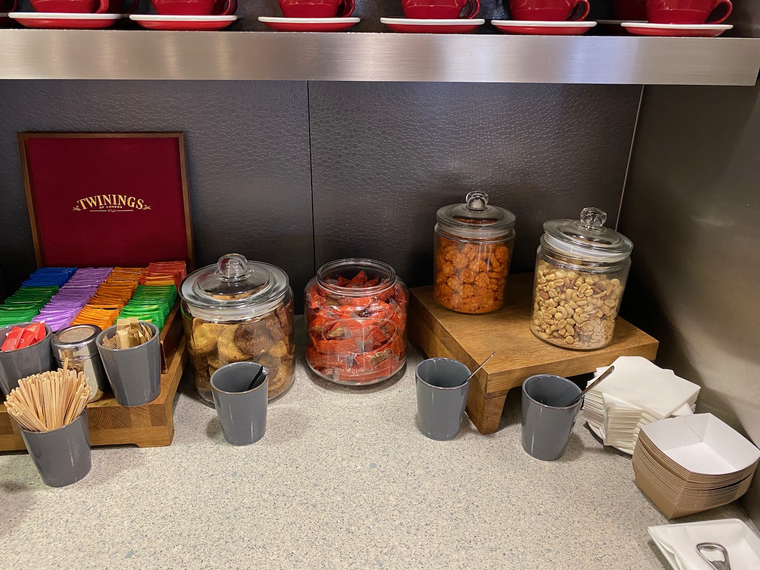 a group of glass jars with food on a counter