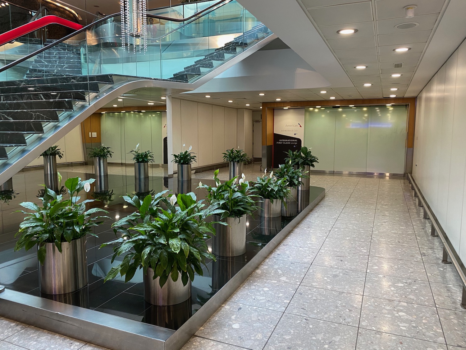 a building with stairs and plants