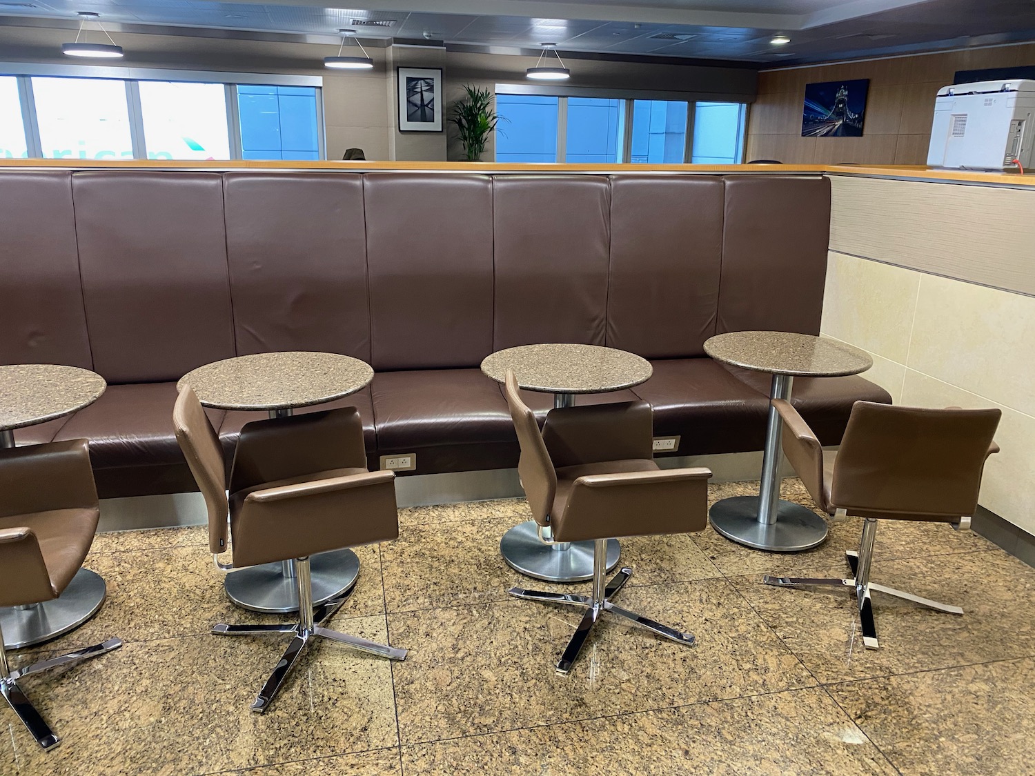 a group of tables and chairs in a booth