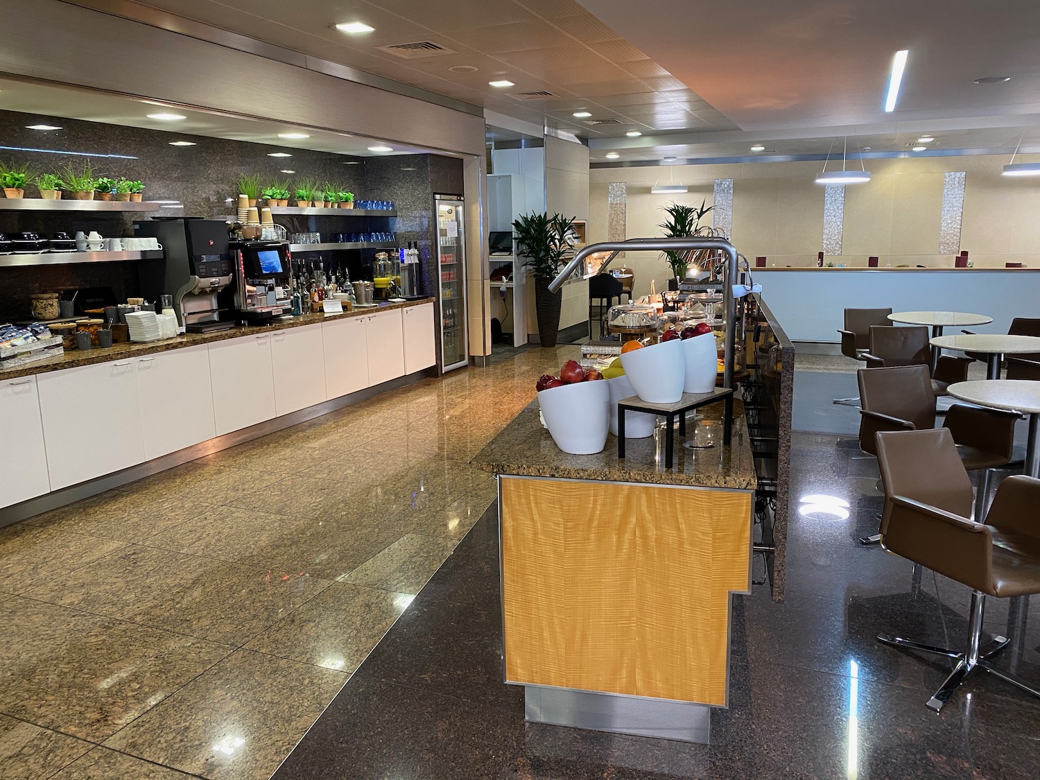 a restaurant with a counter and chairs