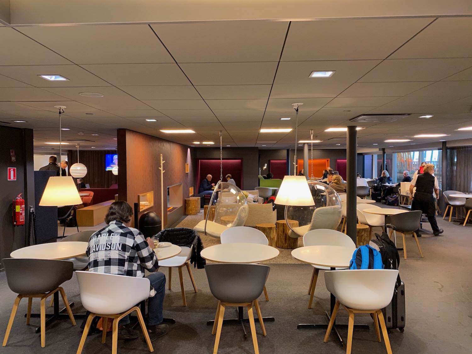 a group of people sitting at tables in a room