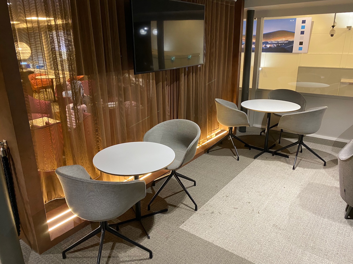 a group of chairs and a tv in a room