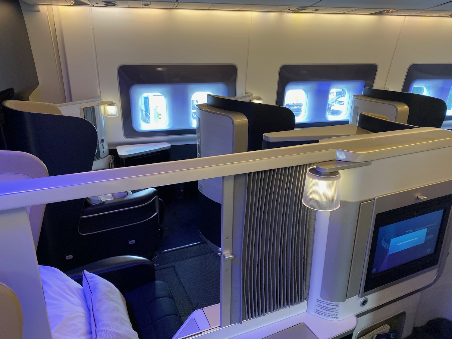 a room with tvs and screens on the side