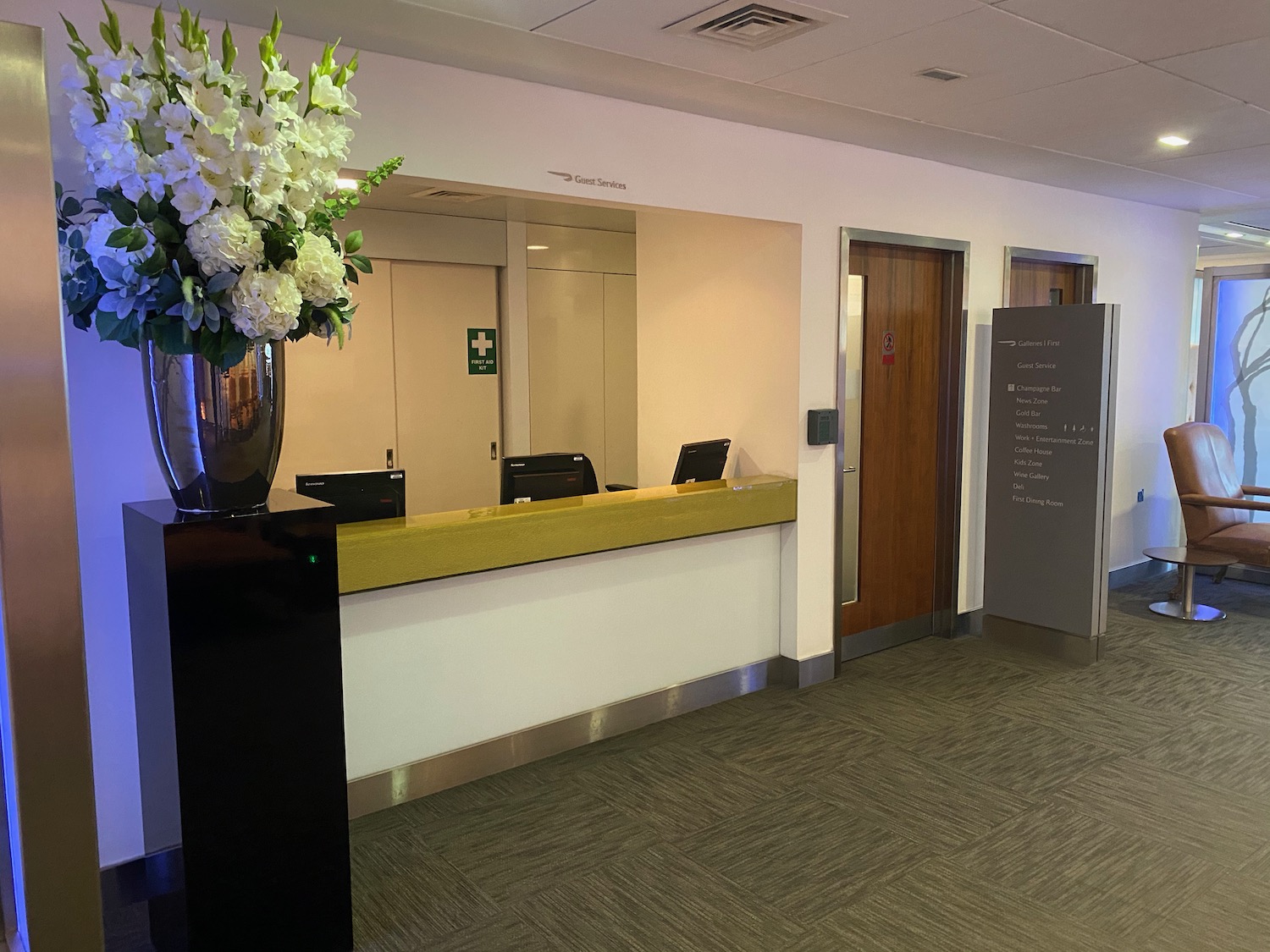 a lobby with a vase of flowers