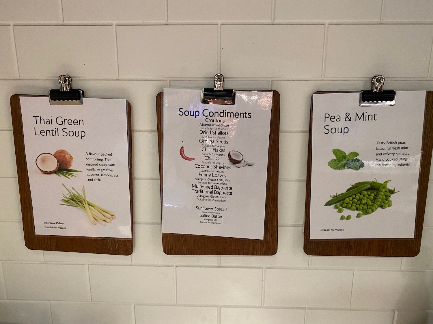 a group of clipboards with different types of food on them