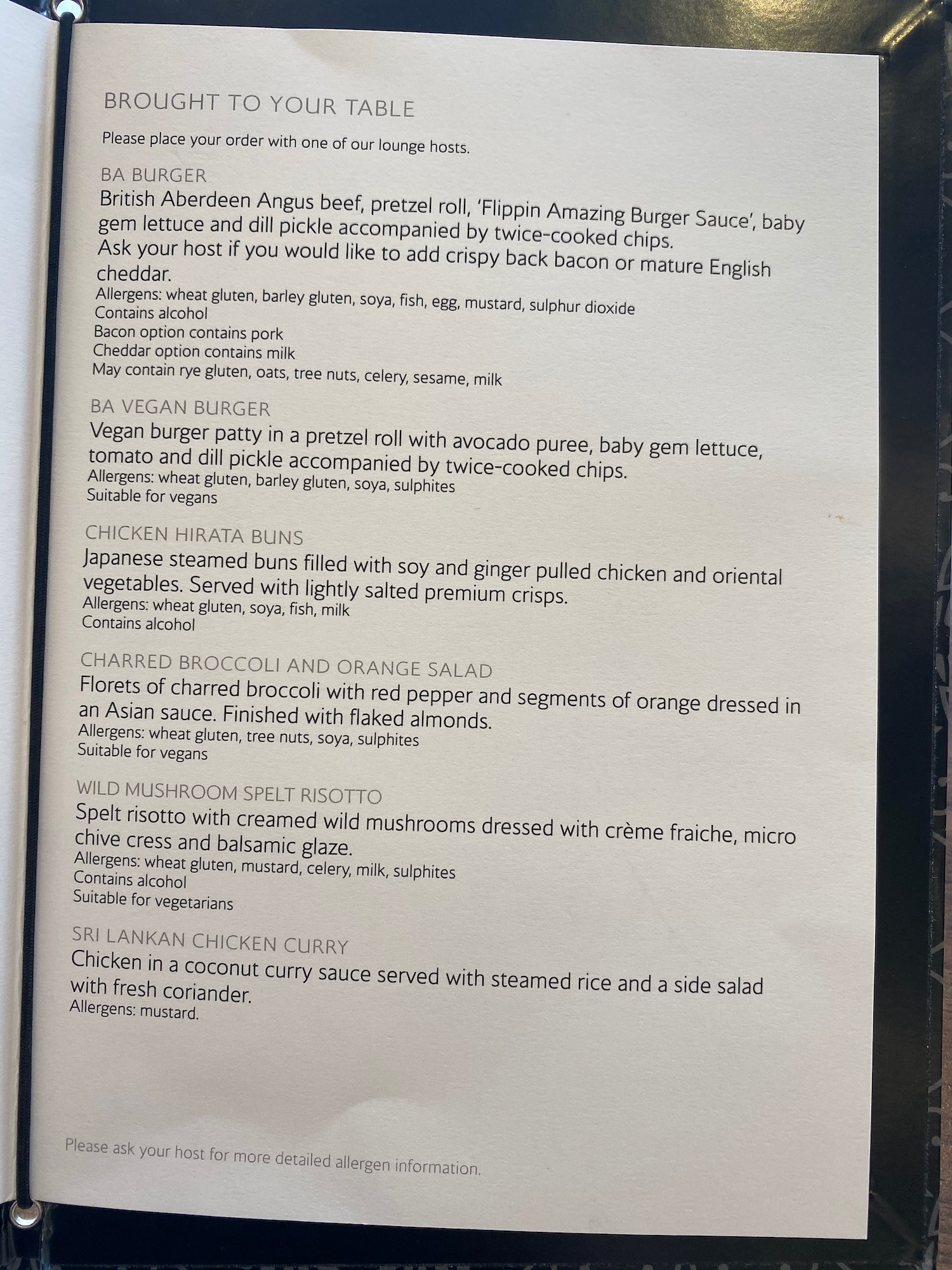 a menu on a black surface