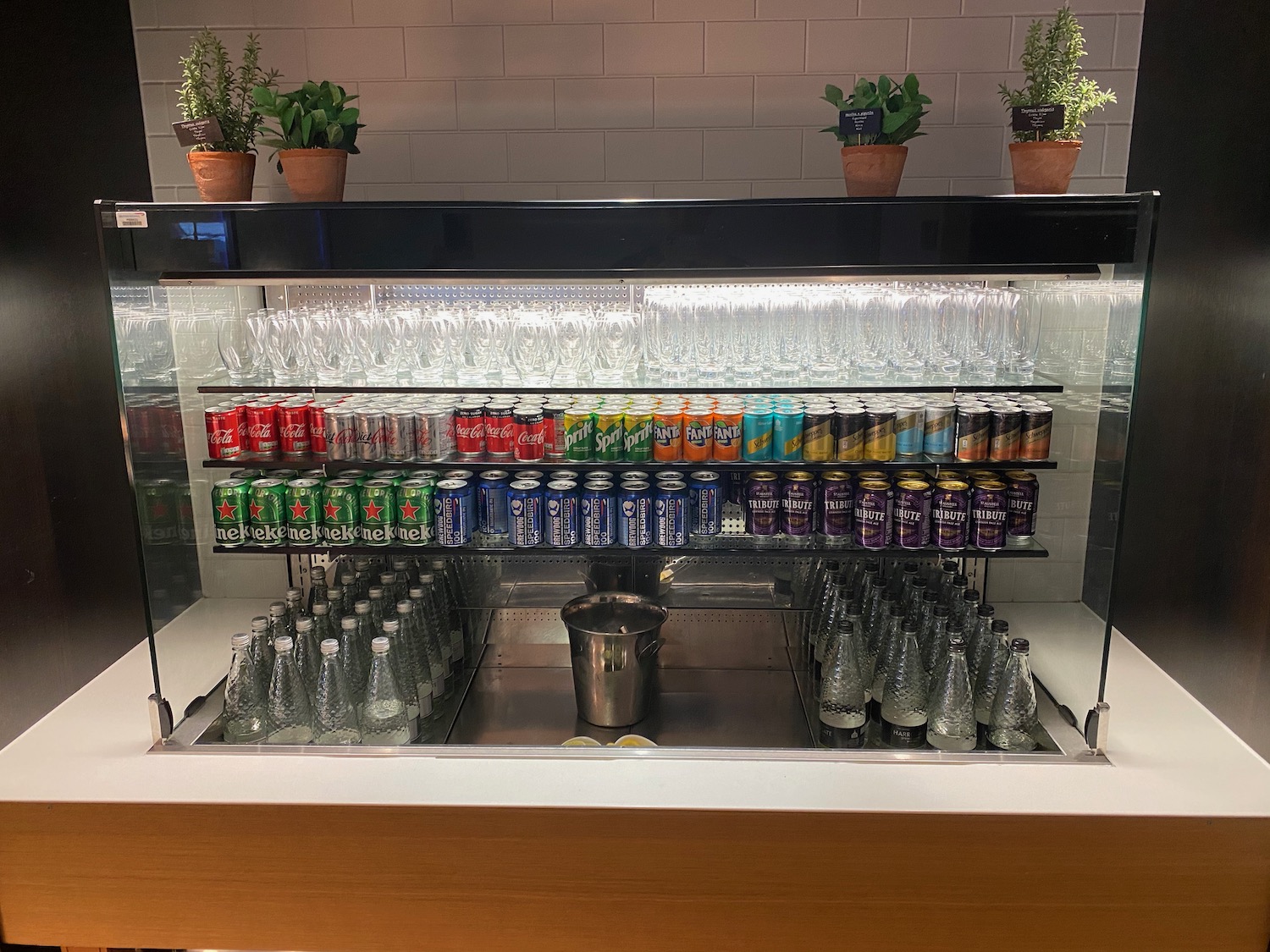 a display case with drinks and bottles