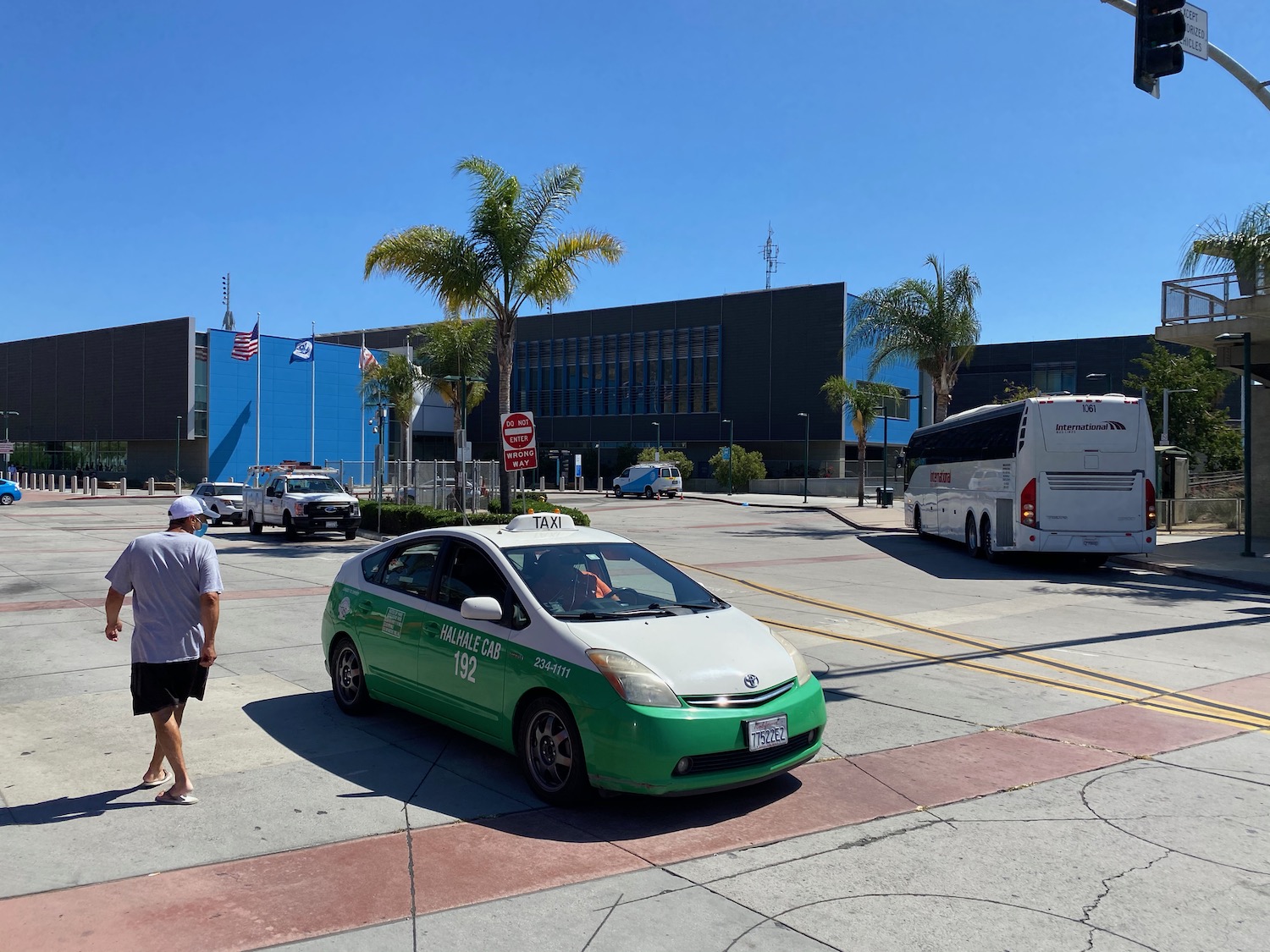 a green and white car parked on a street