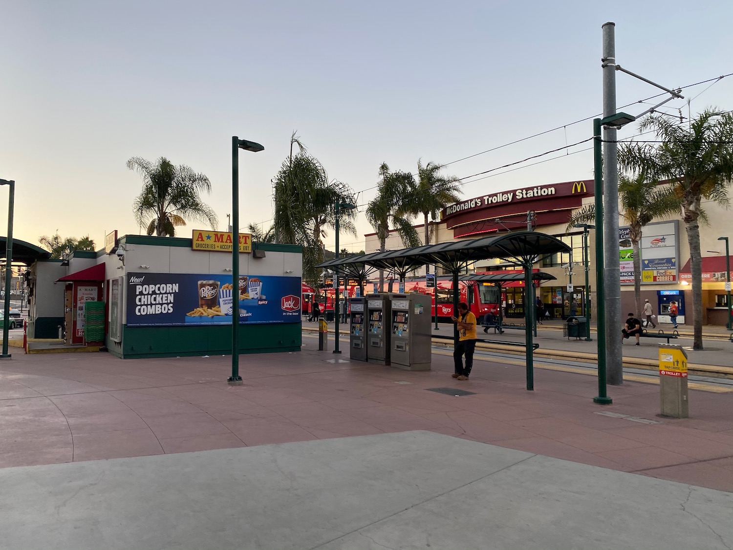 a street with a building and a bus stop