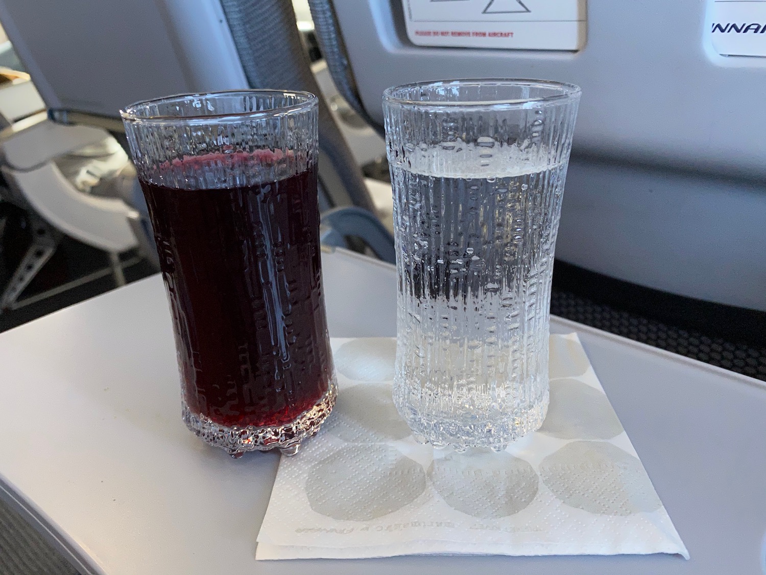 two glasses of liquid on a table