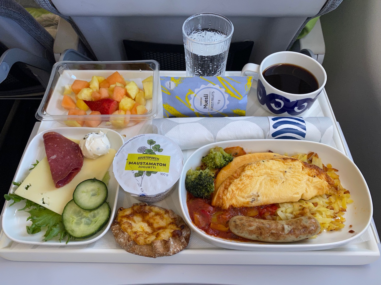 a tray of food and drinks on a plane